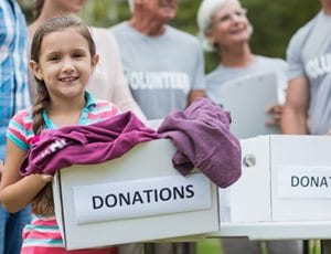 Child holding a donations box