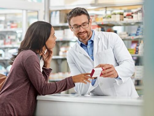 male pharmacist with customer